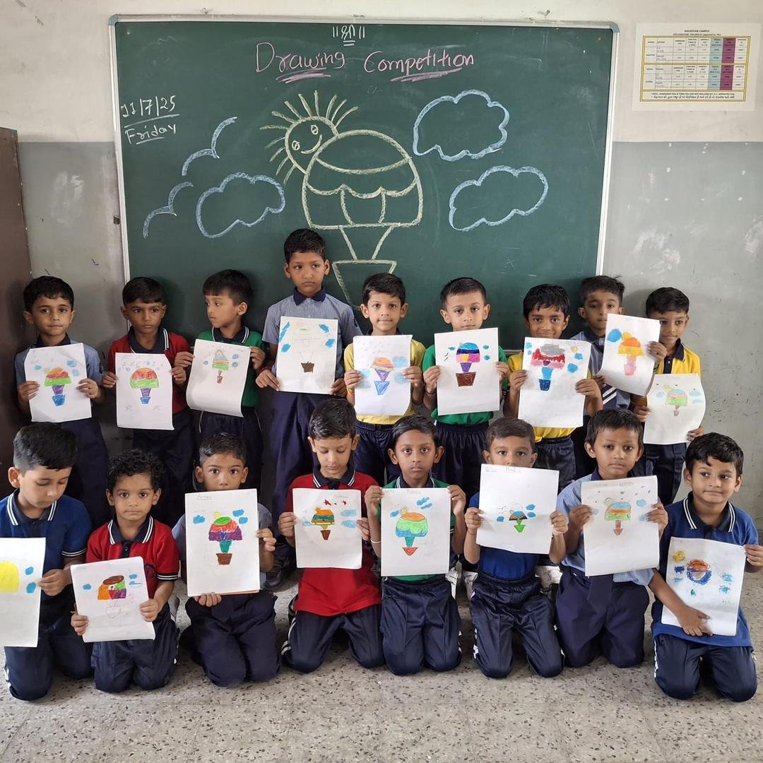 Children with their drawing competition artwork